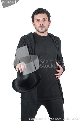 Image of Man in black with his black hat