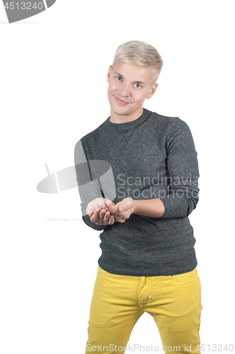 Image of Shot of man in gray and yellow holding something