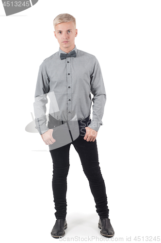 Image of Male in shirt and bow-tie standing