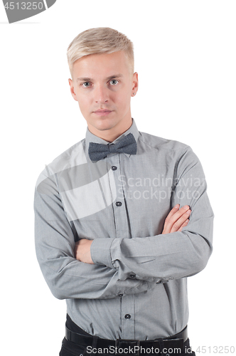 Image of Male in shirt and bow-tie standing