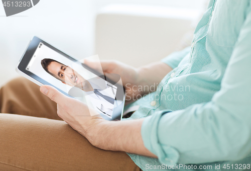 Image of patient having video chat with doctor on tablet pc