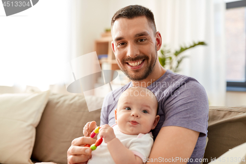 Image of happy father with little baby daughter at home