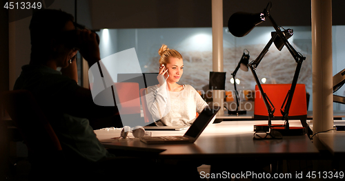 Image of young designers in the night office