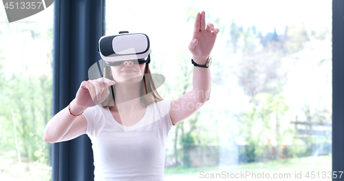 Image of woman using VR-headset glasses of virtual reality