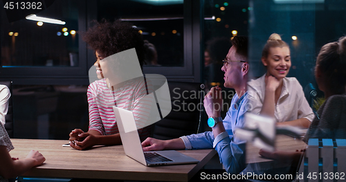 Image of Multiethnic startup business team in night office