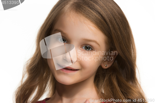 Image of The happy teen girl standing and smiling against white background.