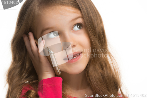 Image of The happy teen girl standing and smiling against white background.