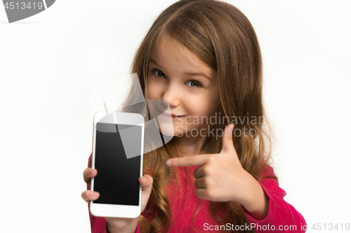 Image of The happy teen girl standing and smiling against white background.