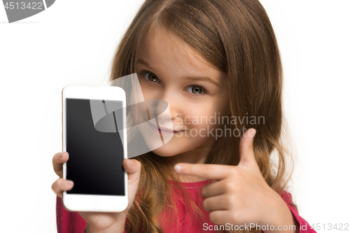 Image of The happy teen girl standing and smiling against white background.