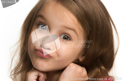 Image of The happy teen girl standing and smiling against white background.