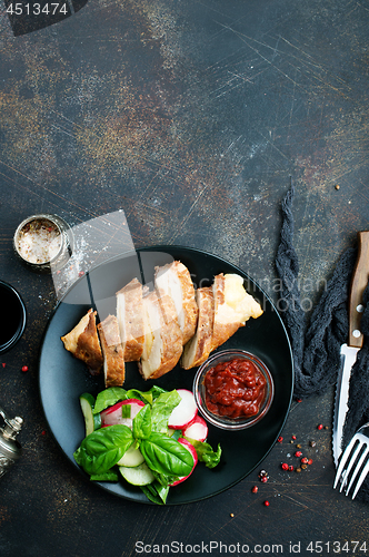 Image of meat with salad