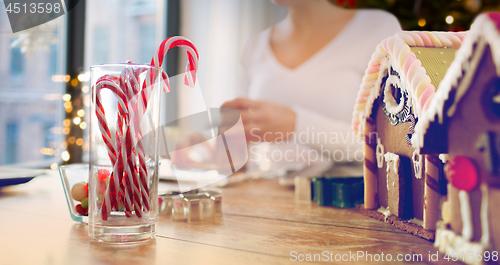 Image of close up of candy canes and gingerbread houses