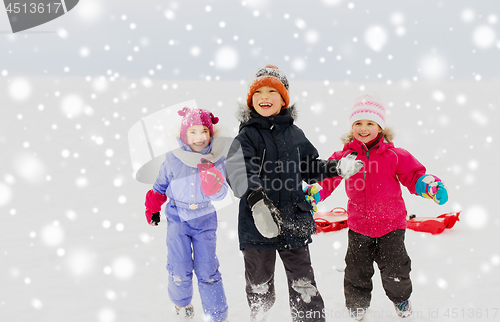 Image of happy little kids playing outdoors in winter