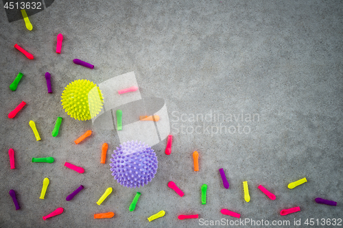 Image of Colorful balloons and rubber balls on concrete background