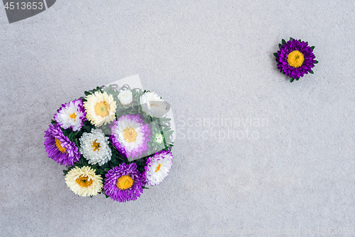 Image of Bouquet of asters on concrete background