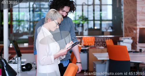 Image of Business People Working With Tablet in office