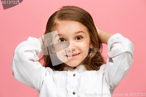 Image of Beautiful teen girl looking suprised isolated on pink