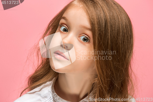 Image of Beautiful teen girl looking suprised isolated on pink