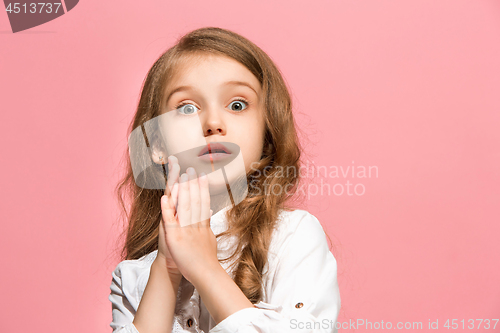 Image of Beautiful teen girl looking suprised isolated on pink