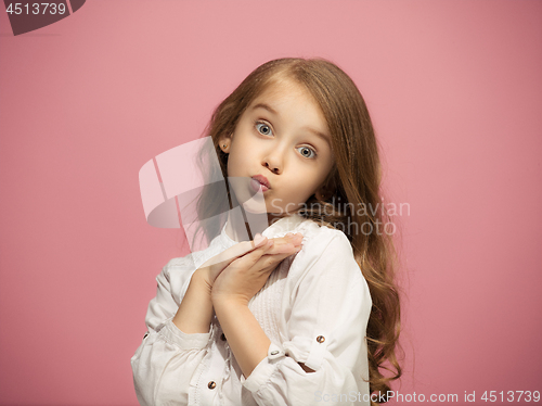 Image of Beautiful teen girl looking suprised isolated on pink