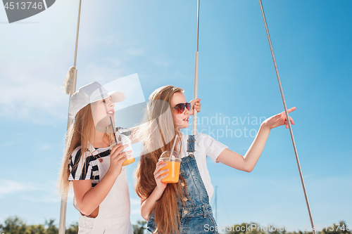 Image of The children on board of sea yacht