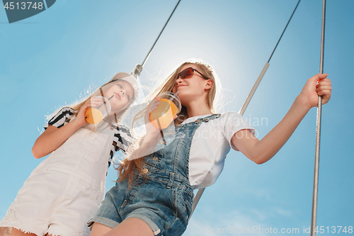 Image of The children on board of sea yacht