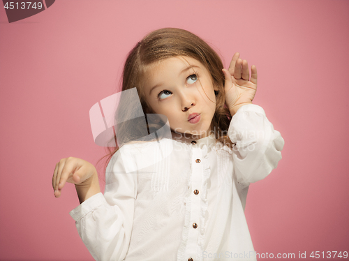 Image of Beautiful teen girl looking suprised isolated on pink