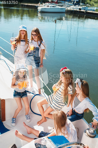 Image of The children on board of sea yacht