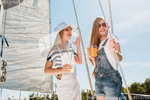 Image of The children on board of sea yacht