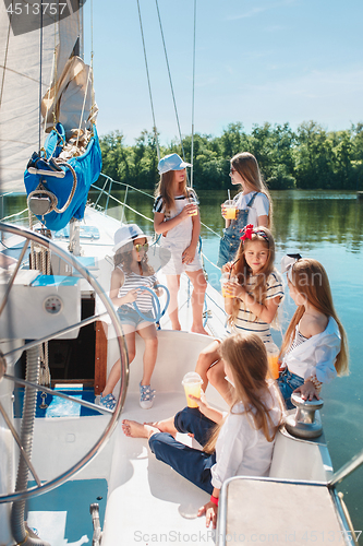 Image of The children on board of sea yacht