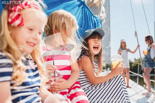 Image of The children on board of sea yacht