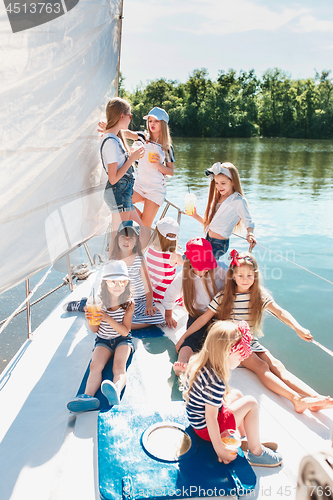 Image of The children on board of sea yacht