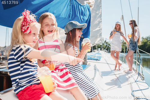 Image of The children on board of sea yacht