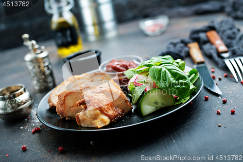 Image of meat with salad