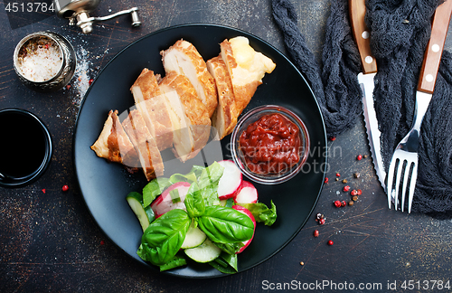Image of meat with salad