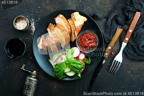 Image of meat with salad