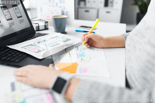 Image of web designer working on user interface at office