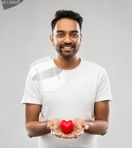 Image of smiling indian man with red heart over grey