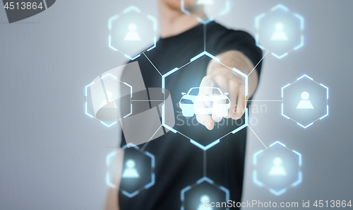 Image of businessman with virual hologram of car sharing