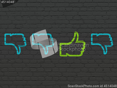 Image of Social media concept: thumb up icon on wall background