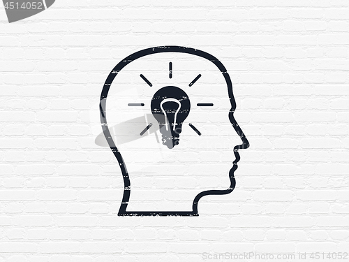 Image of Data concept: Head With Lightbulb on wall background