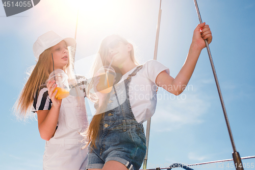 Image of The children on board of sea yacht