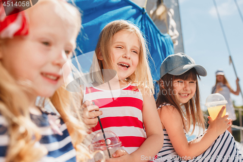 Image of The children on board of sea yacht