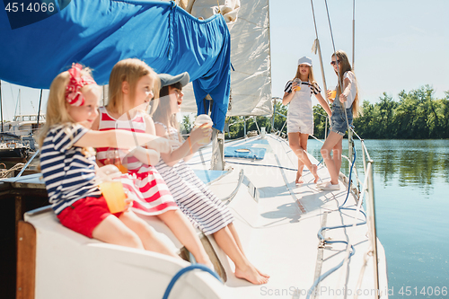 Image of The children on board of sea yacht