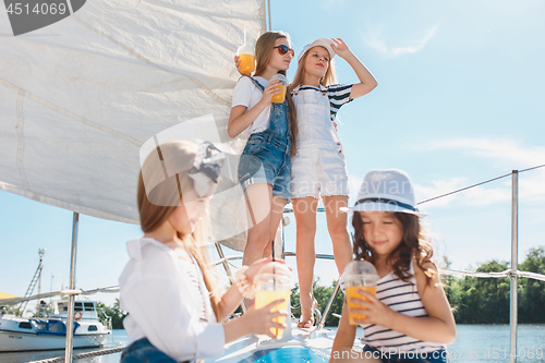 Image of The children on board of sea yacht