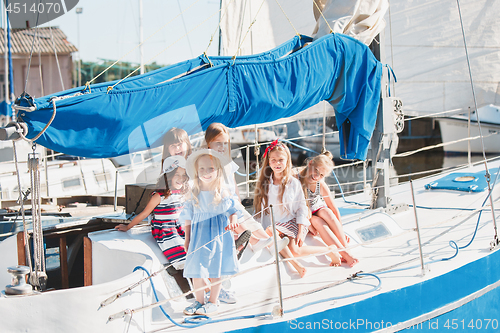 Image of The children on board of sea yacht