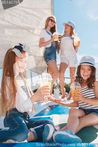 Image of The children on board of sea yacht