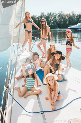 Image of The children on board of sea yacht