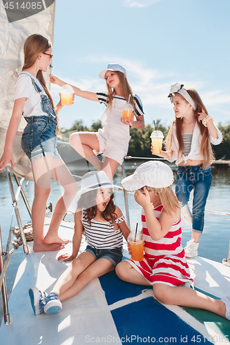 Image of The children on board of sea yacht