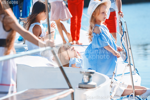 Image of The children on board of sea yacht